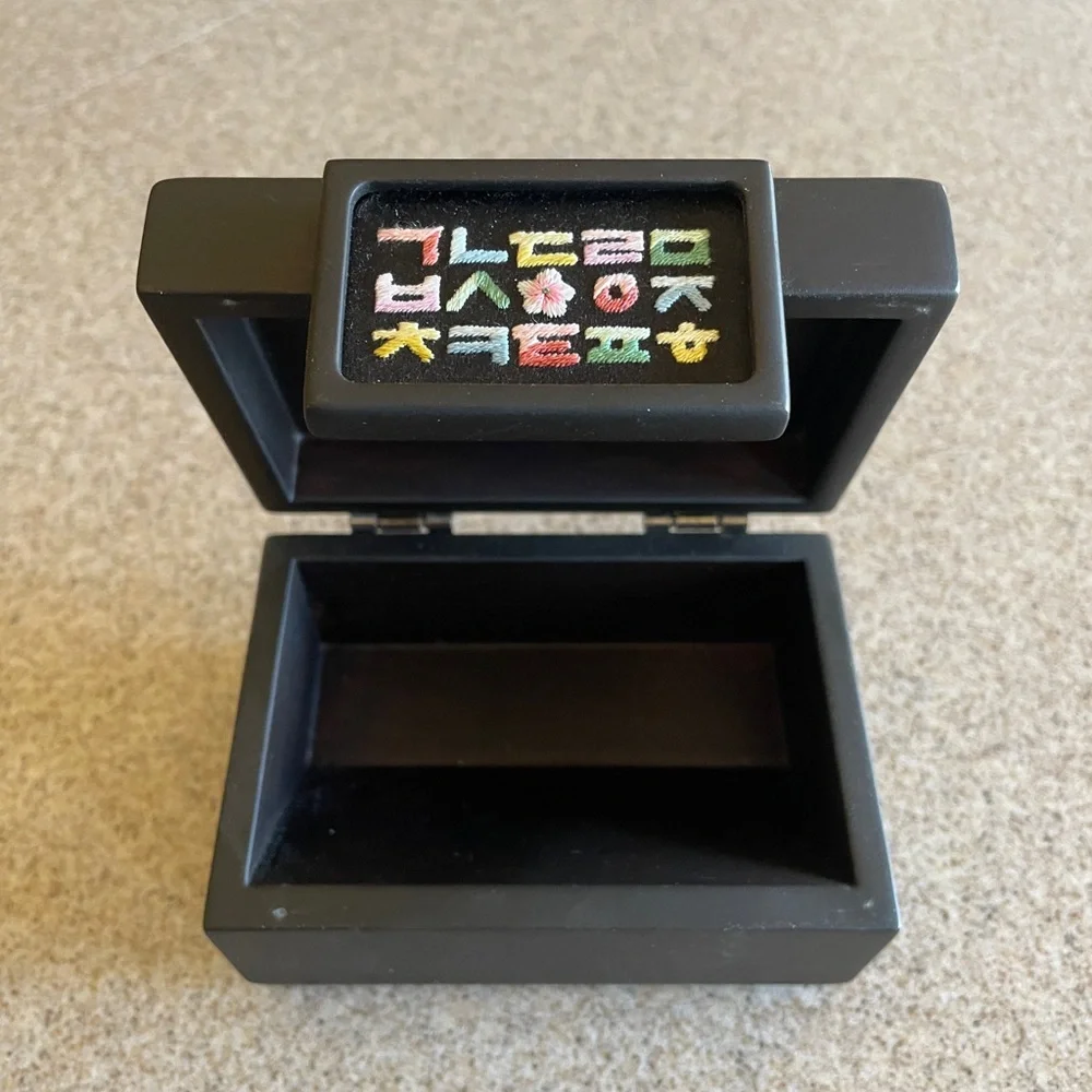 Black Jewelry Box with Colorful Symbols